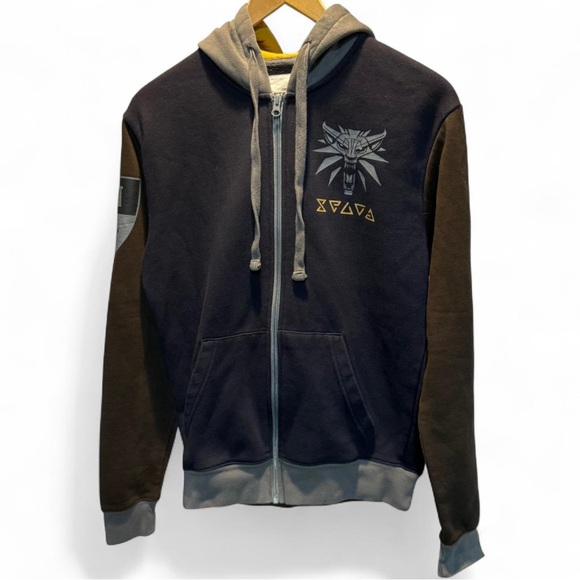 The Witcher Wild Hunt Black and Brown zip up hooded Jacket.
P-P 20.5”
L
25” - Picture 1 of 4